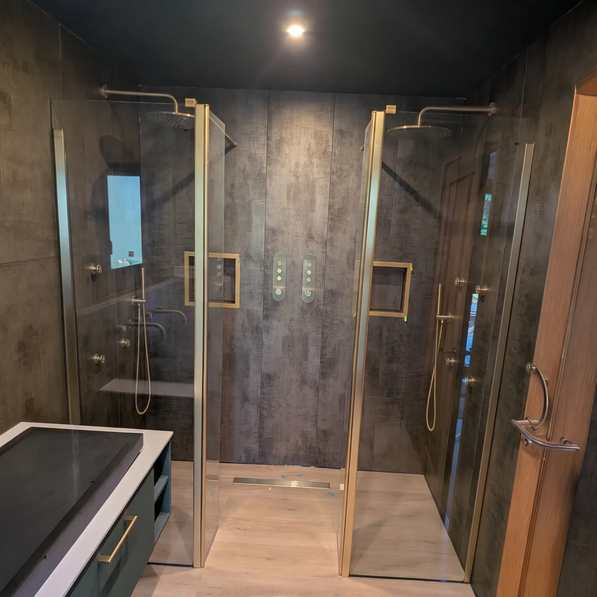 Bathroom wall being tiled over tanking in a Plymouth home
